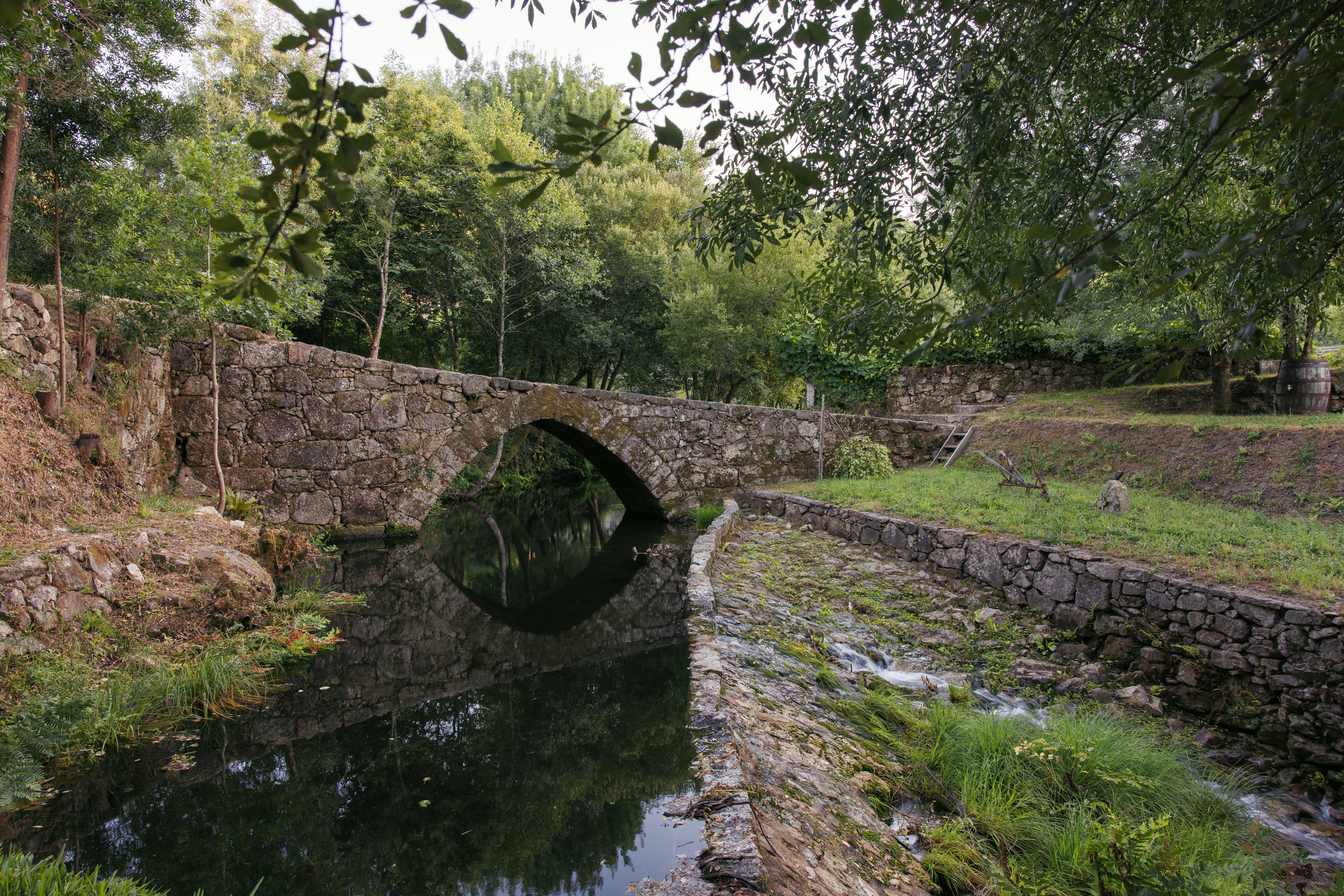 Ancient Roman bridge over river near Peneda-Gerês National Park